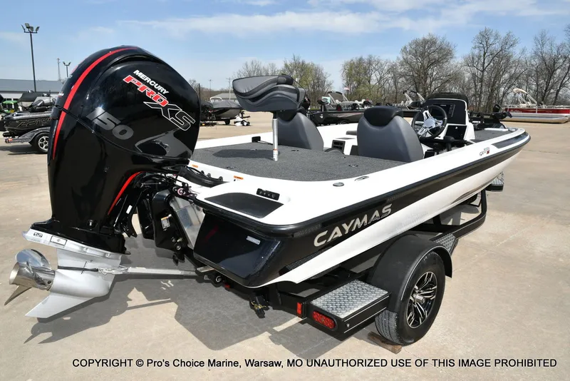 Slide: The Image of 2023 Caymas CX 18 boat with 150 Mercury Pro-XS 4 Stroke engine, parked outdoors. - 17