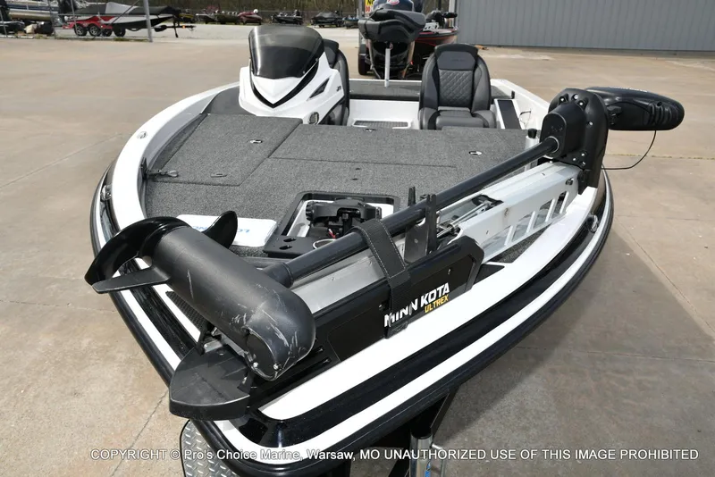 Slide: The Image of 2023 Caymas CX 18 boat with Minn Kota Ultrex trolling motor, featuring spacious deck and seating. - 31