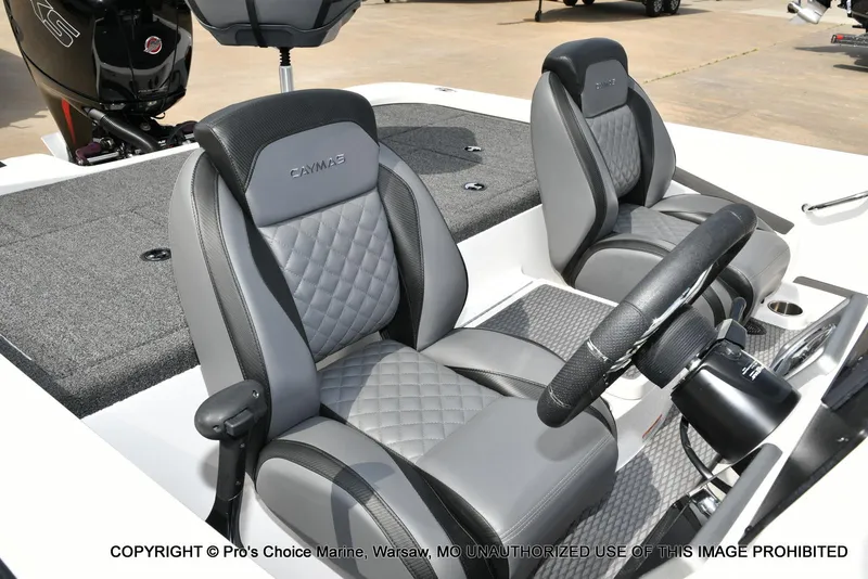 Slide: The Image of 2023 Caymas CX 18 boat interior with dual seats and steering wheel. - 38