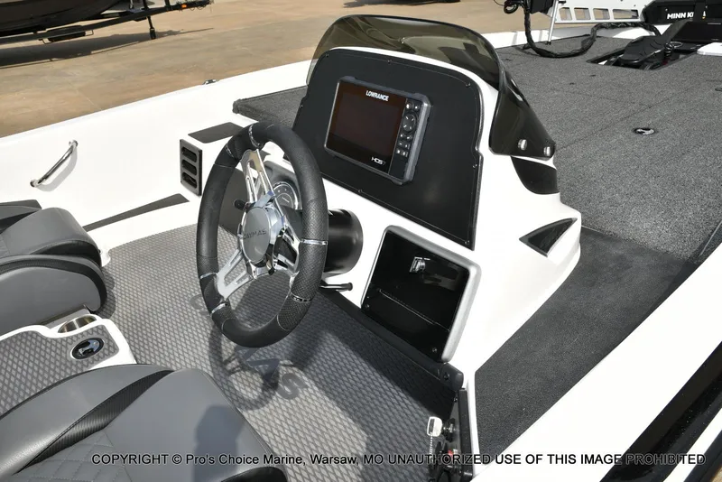 Slide: The Image of 2023 Caymas CX 18 boat interior with steering wheel and navigation display. - 40