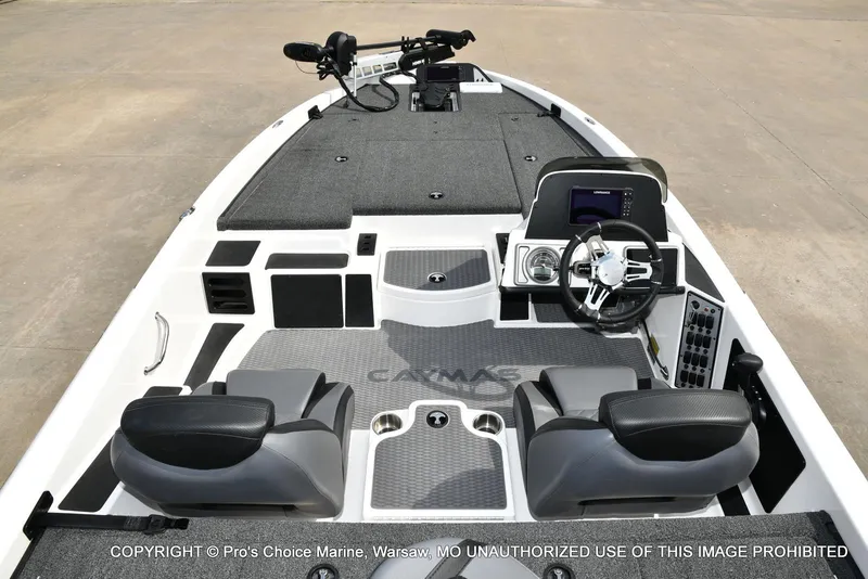 Slide: The Image of 2023 Caymas CX 18 boat interior with steering console and seating. - 44