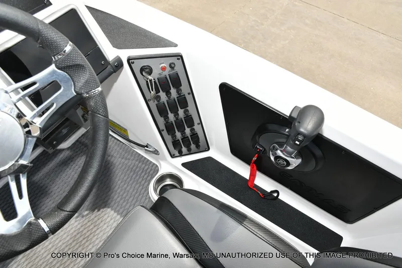 Slide: The Image of 2023 Caymas CX 18 boat cockpit with steering wheel and control panel. - 47