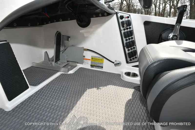 Slide: The Image of 2023 Caymas CX 18 boat interior with control panel and seating, featuring Mercury Pro-XS engine. - 49