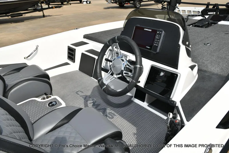 Slide: The Image of 2023 Caymas CX 18 boat interior with steering wheel and navigation display. - 6