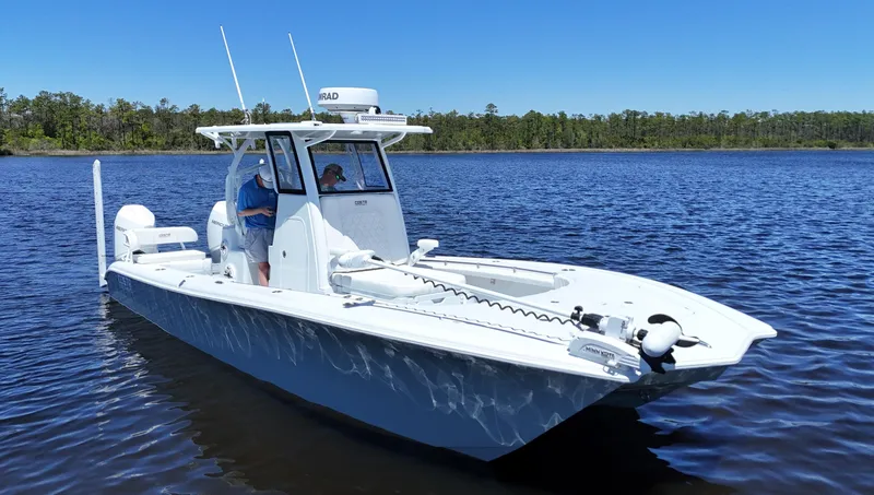 Slide: The Image of 2022 Costa Custom Boats 264 HC on calm water, featuring sleek design and modern equipment. - 1