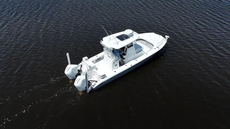 Slide: The Image of 2022 Costa Custom Boats 264 HC on calm water, aerial view. - 16