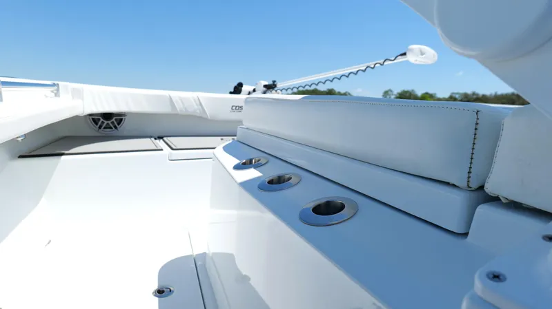 Slide: The Image of 2022 Costa Custom Boats 264 HC interior with white seating and rod holders. - 23