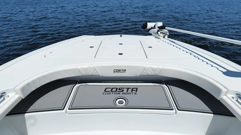 Slide: The Image of 2022 Costa Custom Boats 264 HC on water, showcasing sleek design and craftsmanship. - 28