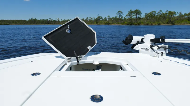 Slide: The Image of 2022 Costa Custom Boats 264 HC deck with open hatch, on calm water. - 32