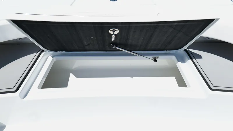 Slide: The Image of Open storage compartment on 2022 Costa Custom Boats 264 HC. - 34