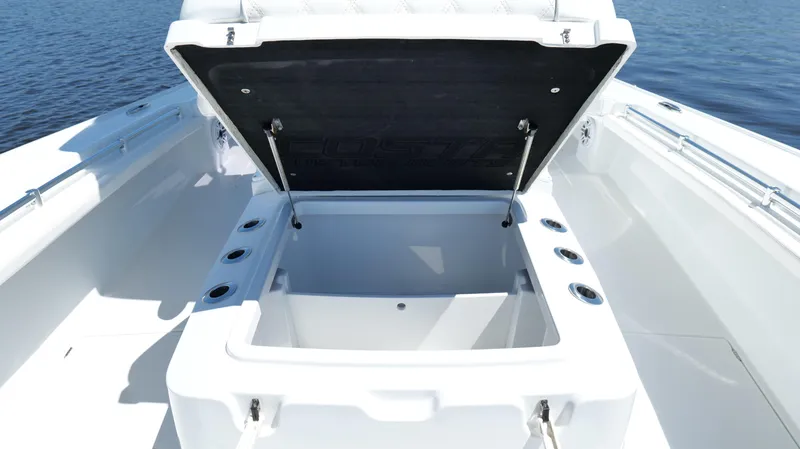 Slide: The Image of 2022 Costa Custom Boats 264 HC open storage compartment on deck, showcasing spacious design. - 40