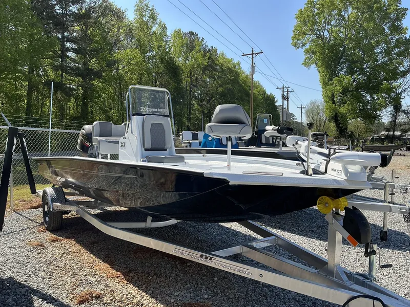 Slide: The Image of 2025 Xpress Hyper-Lift Series H20B boat on trailer, parked outdoors. - 1