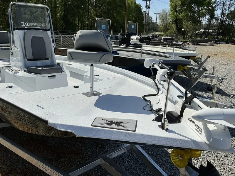 Slide: The Image of 2025 Xpress Hyper-Lift Series H20B boat with new console, displayed outdoors. - 6