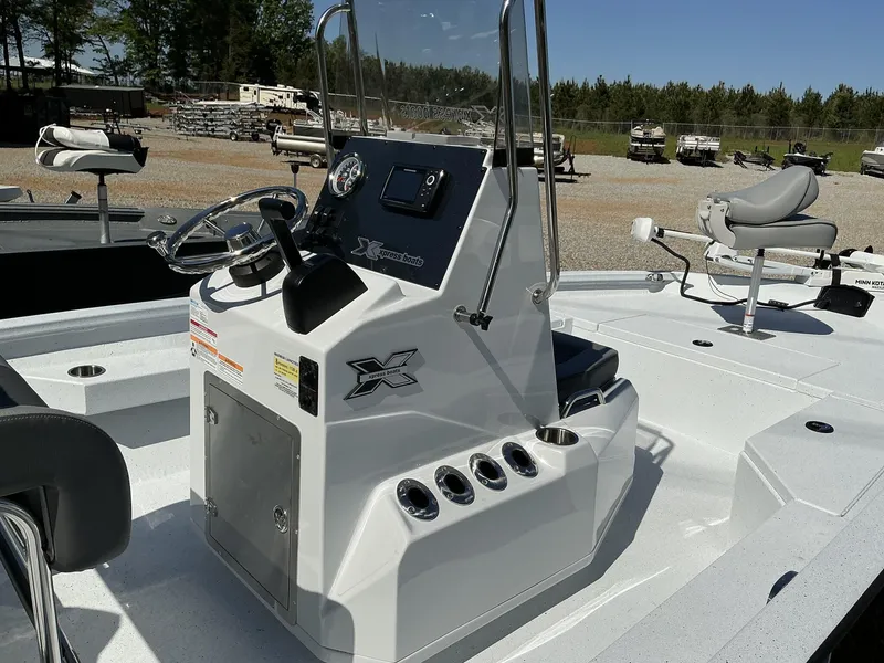 Slide: The Image of 2025 Xpress Hyper-Lift Series H20B boat console with steering wheel and seating. - 7