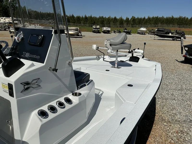 Slide: The Image of 2025 Xpress Hyper-Lift Series H20B boat with new console, parked outdoors. - 8