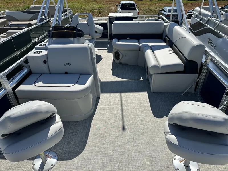 Slide: The Image of 2024 Avalon VTX Quad Fish boat interior with plush seating and modern design. - 2