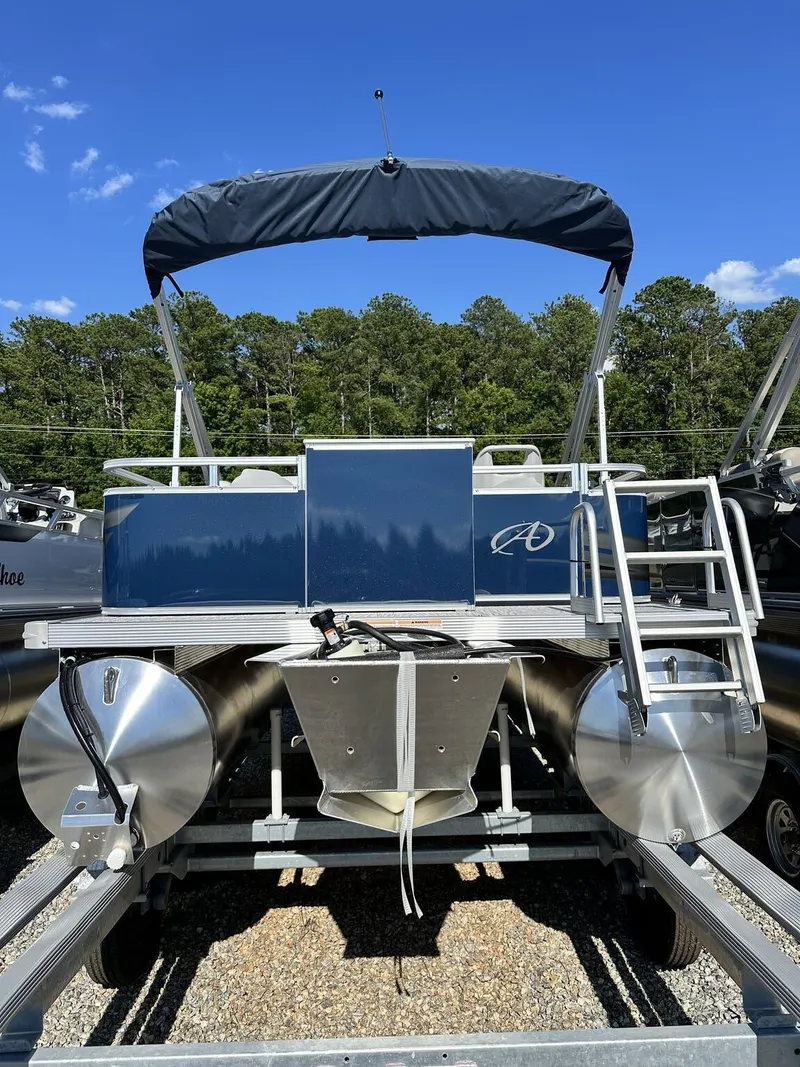 Slide: The Image of 2024 Avalon VTX Quad Fish pontoon boat, 19 feet, with canopy, parked outdoors. - 4