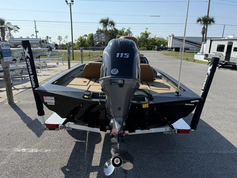 Slide: The Image of 2025 Xpress Hyper-Lift Series H18 bass boat with 115 horsepower engine, parked outdoors. - 3