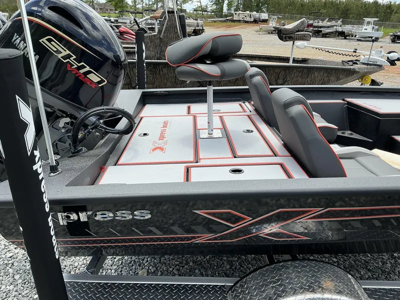 Slide: The Image of 2025 Xpress Hyper-Lift Series H18 bass boat with Yamaha engine, featuring sleek seating and storage. - 7