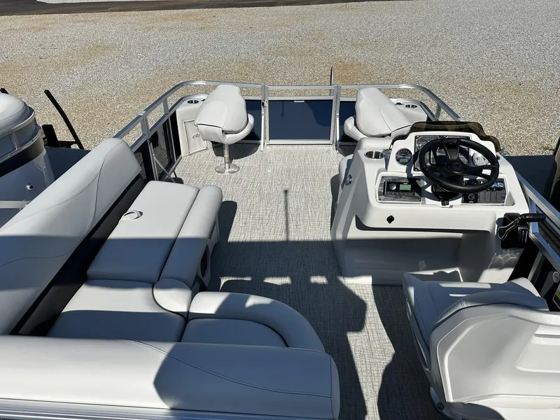 Slide: The Image of 2024 Avalon VTX Quad Fish boat interior with seating and steering console. - 9