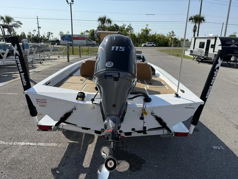 Slide: The Image of 2025 Xpress Hyper-Lift Series H18 Crappie Model boat with 115 HP engine, parked outdoors. - 5