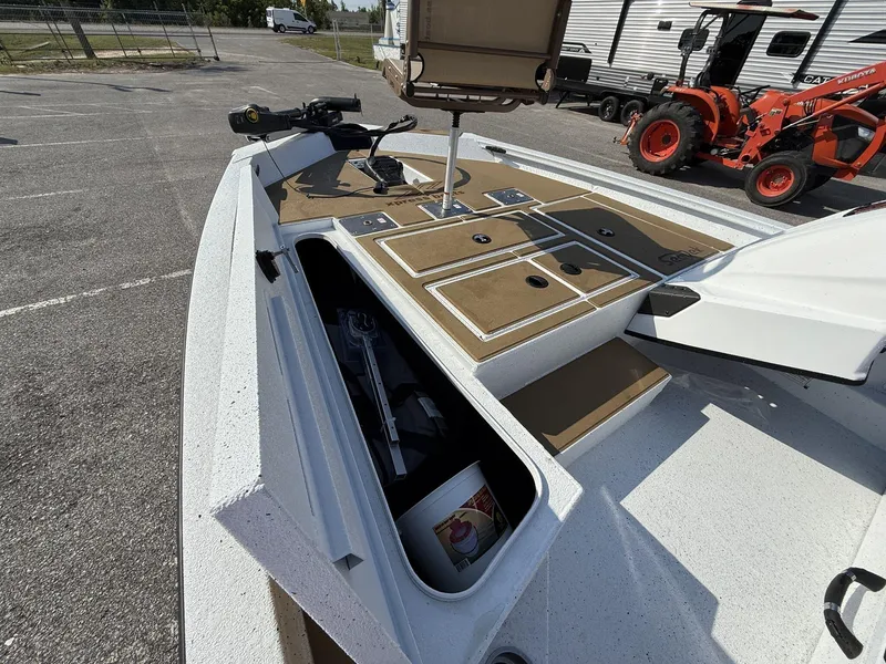 Slide: The Image of 2025 Xpress Hyper-Lift H18 Crappie boat with open storage compartments and fishing gear. - 9
