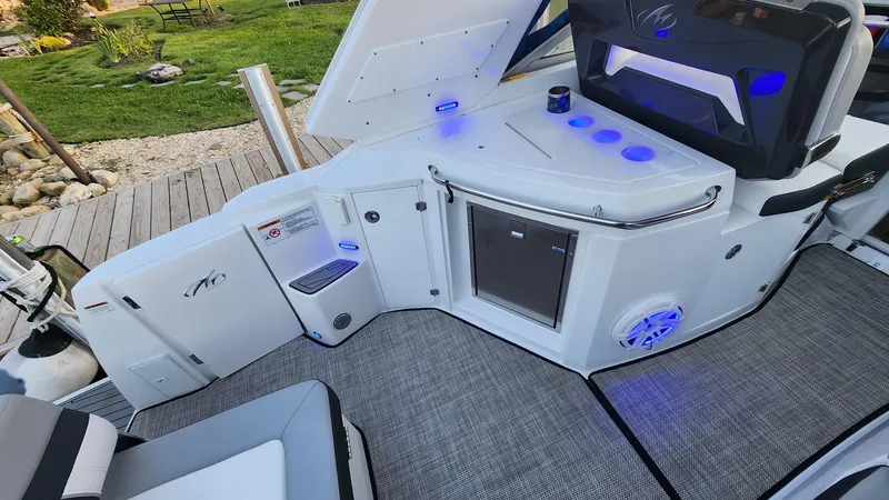 Slide: The Image of 2021 Monterey 335 Sport Yacht interior with modern amenities and blue LED lighting. - 15