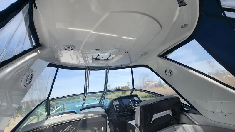 Slide: The Image of Interior view of 2021 Monterey 335 Sport Yacht cockpit with modern design and panoramic windows. - 24