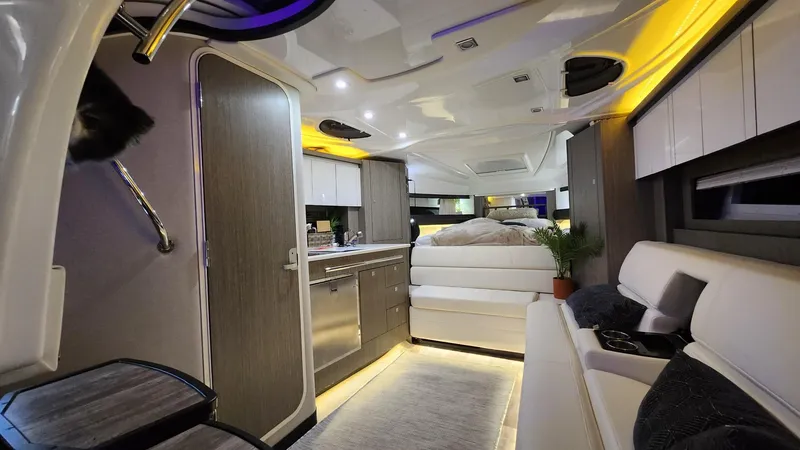 Slide: The Image of Luxurious interior of a 2021 Monterey 335 Sport Yacht with modern amenities and ambient lighting. - 26