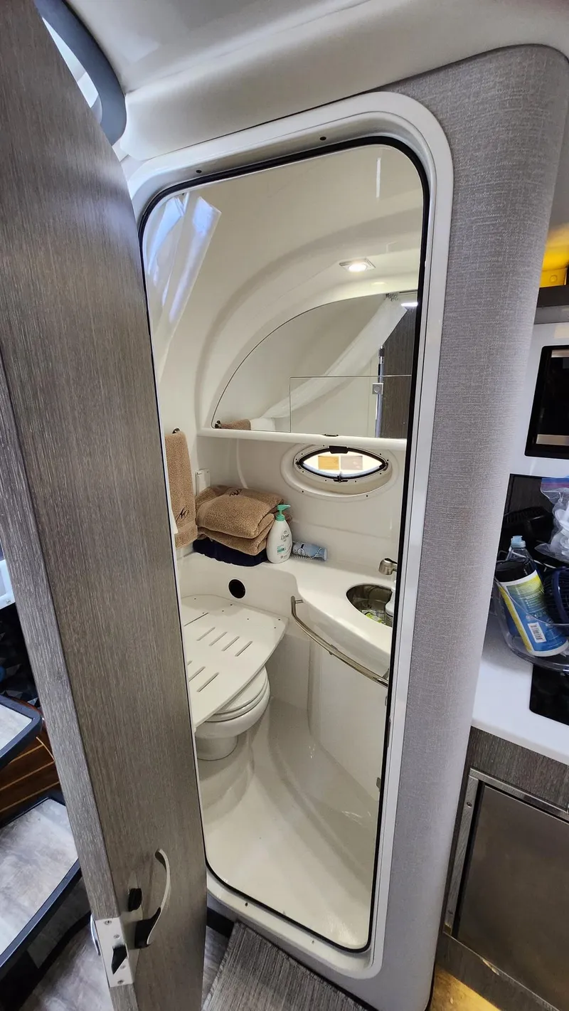 Slide: The Image of 2021 Monterey 335 Sport Yacht bathroom interior with modern fixtures and compact design. - 27
