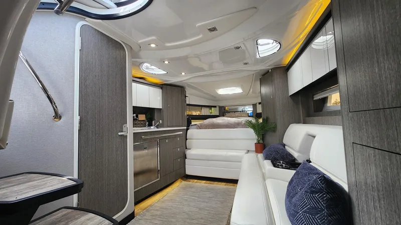 Slide: The Image of Luxurious interior of 2021 Monterey 335 Sport Yacht with modern furnishings and ambient lighting. - 29