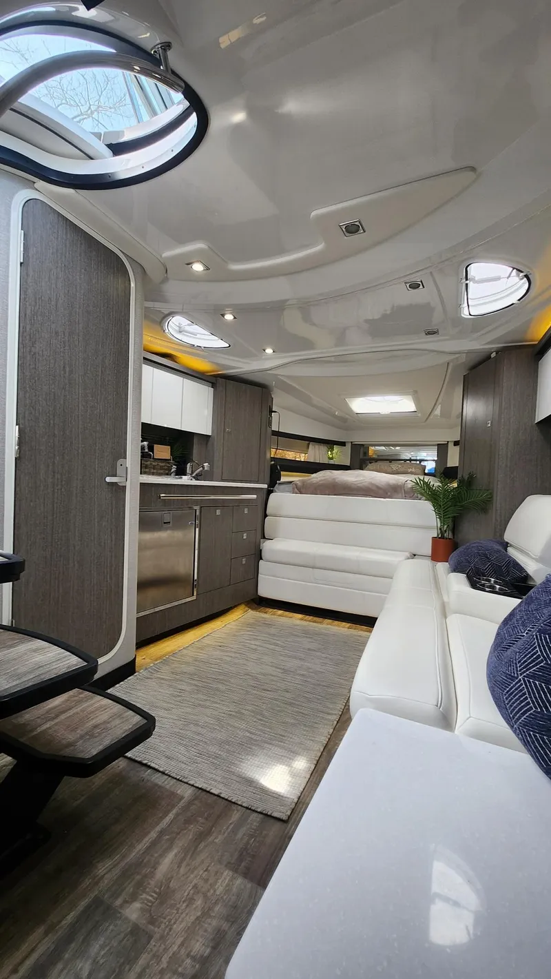 Slide: The Image of Interior of 2021 Monterey 335 Sport Yacht with modern design and luxurious seating. - 33