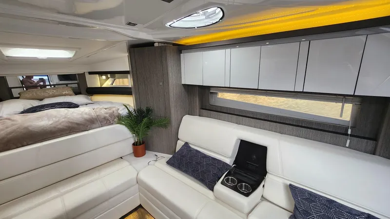 Slide: The Image of Luxurious interior of 2021 Monterey 335 Sport Yacht with white seating and modern decor. - 37