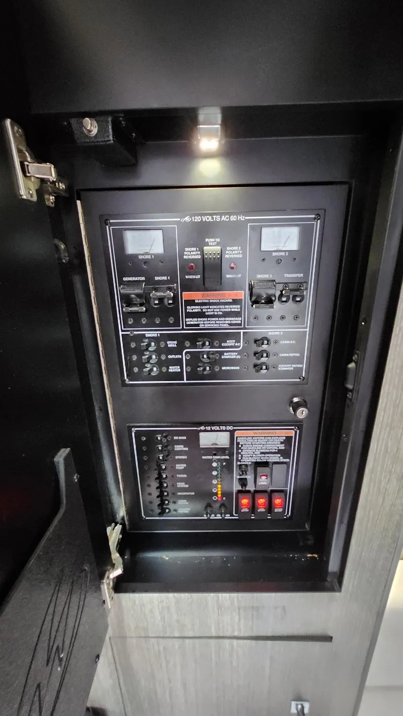 Slide: The Image of Electrical control panel inside 2021 Monterey 335 Sport Yacht. - 40