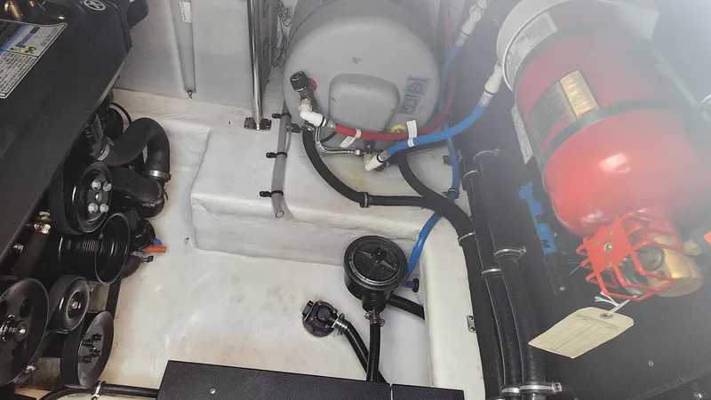 Slide: The Image of Engine compartment of a 2021 Monterey 335 Sport Yacht with visible components and wiring. - 41