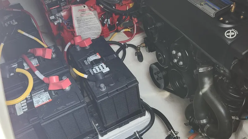 Slide: The Image of Engine compartment of 2021 Monterey 335 Sport Yacht with batteries and wiring. - 42