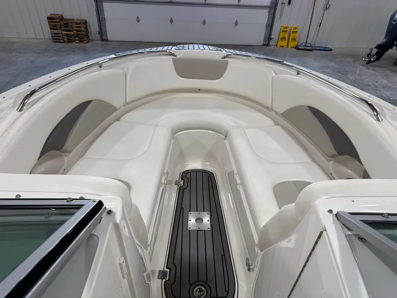 Slide: The Image of 2007 Chaparral 276 SSX boat interior with white seating and sleek design. - 10