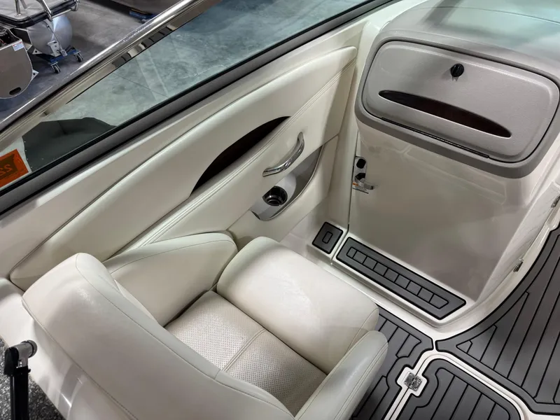 Slide: The Image of 2007 Chaparral 276 SSX boat interior with white seating and sleek design. - 11