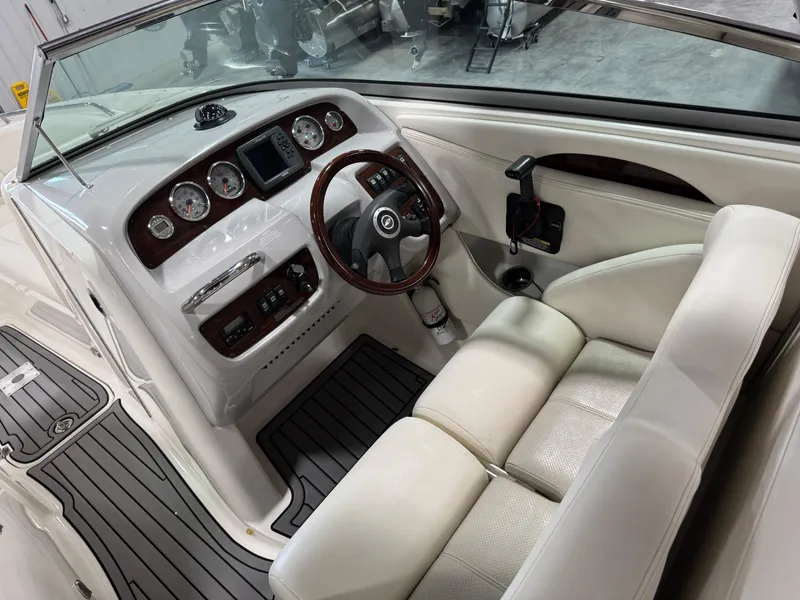 Slide: The Image of 2007 Chaparral 276 SSX boat interior with steering wheel and dashboard controls. - 12