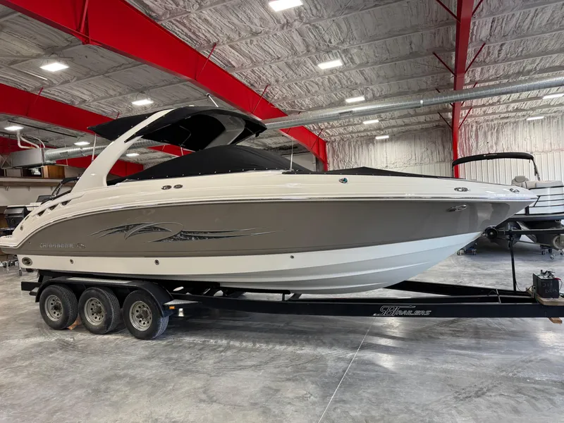 Slide: The Image of 2007 Chaparral 276 SSX boat on trailer in indoor storage facility. - 13