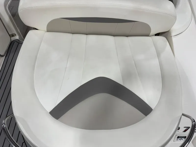 Slide: The Image of White leather seating on 2007 Chaparral 276 SSX boat, featuring sleek design and comfort. - 7