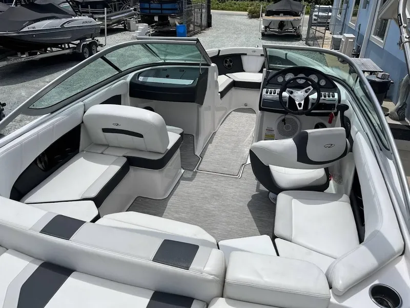 Slide: The Image of 2016 Regal 2000 ESX boat interior with white seating and modern dashboard. - 10
