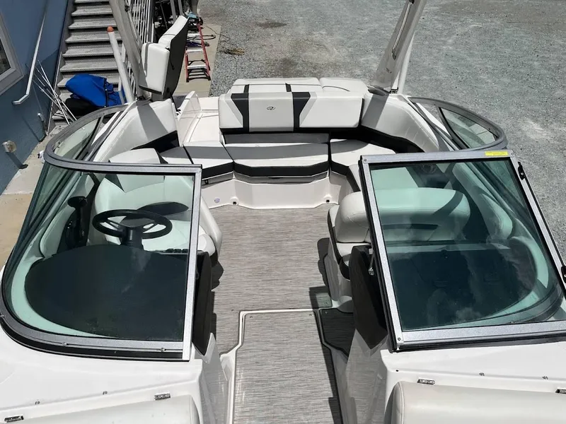Slide: The Image of 2016 Regal 2000 ESX boat interior with white seating and dual windshields. - 6