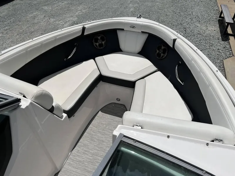 Slide: The Image of 2016 Regal 2000 ESX boat interior with white seating and speakers. - 7