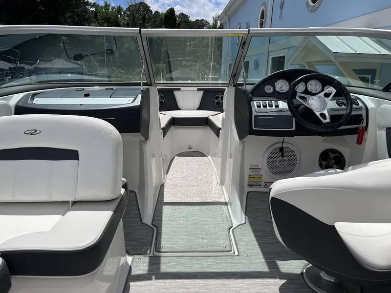 Slide: The Image of Interior of a 2016 Regal 2000 ESX boat with modern dashboard and seating. - 8