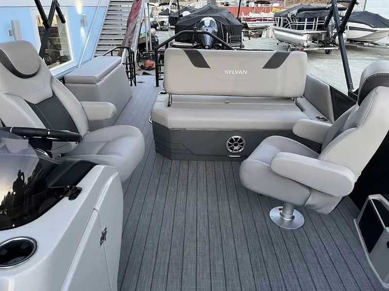 Slide: The Image of 2022 Sylvan L3 DLZ pontoon boat interior with gray seating and modern design. - 13
