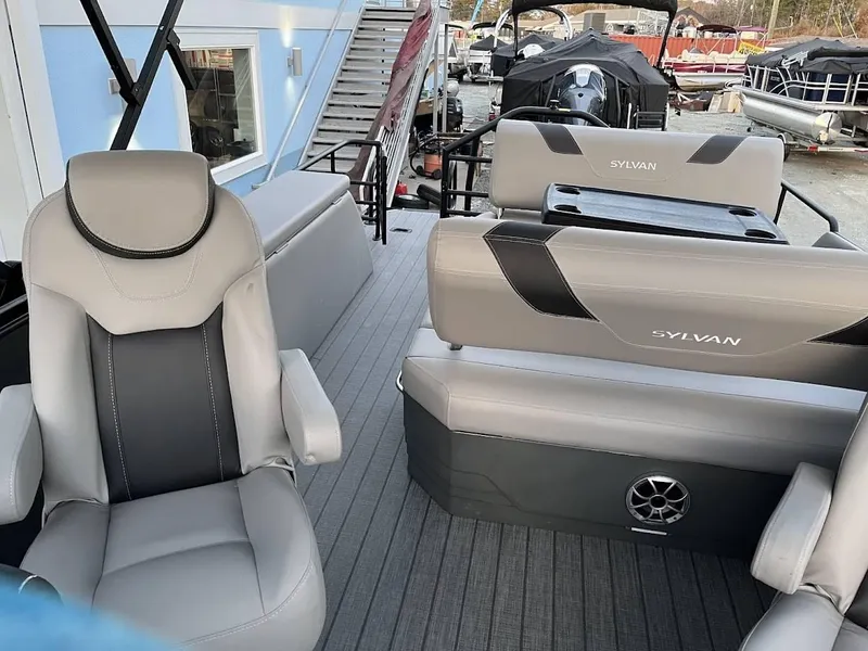 Slide: The Image of 2022 Sylvan L3 DLZ pontoon boat interior with gray seating and modern design. - 2