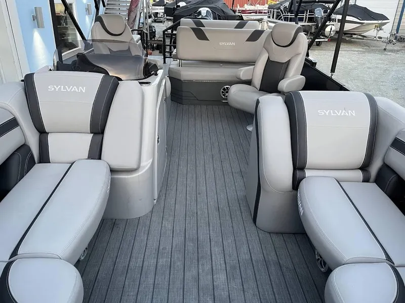 Slide: The Image of 2022 Sylvan L3 DLZ pontoon boat interior with luxurious seating and modern design. - 5