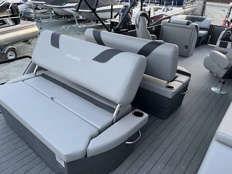 Slide: The Image of 2022 Sylvan L3 DLZ pontoon boat with gray seating and cup holders. - 8