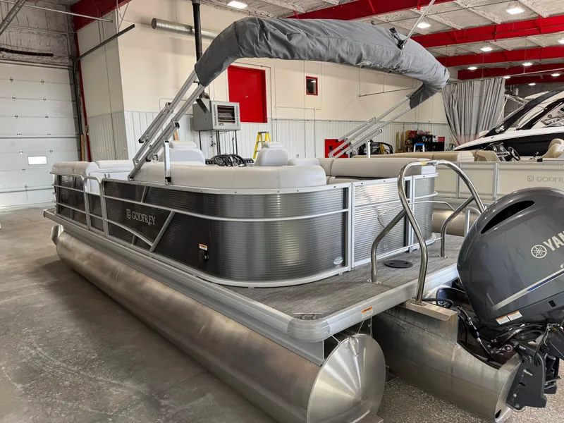Slide: The Image of 2023 Sweetwater 2286 pontoon boat with Yamaha motor in a showroom. - 3